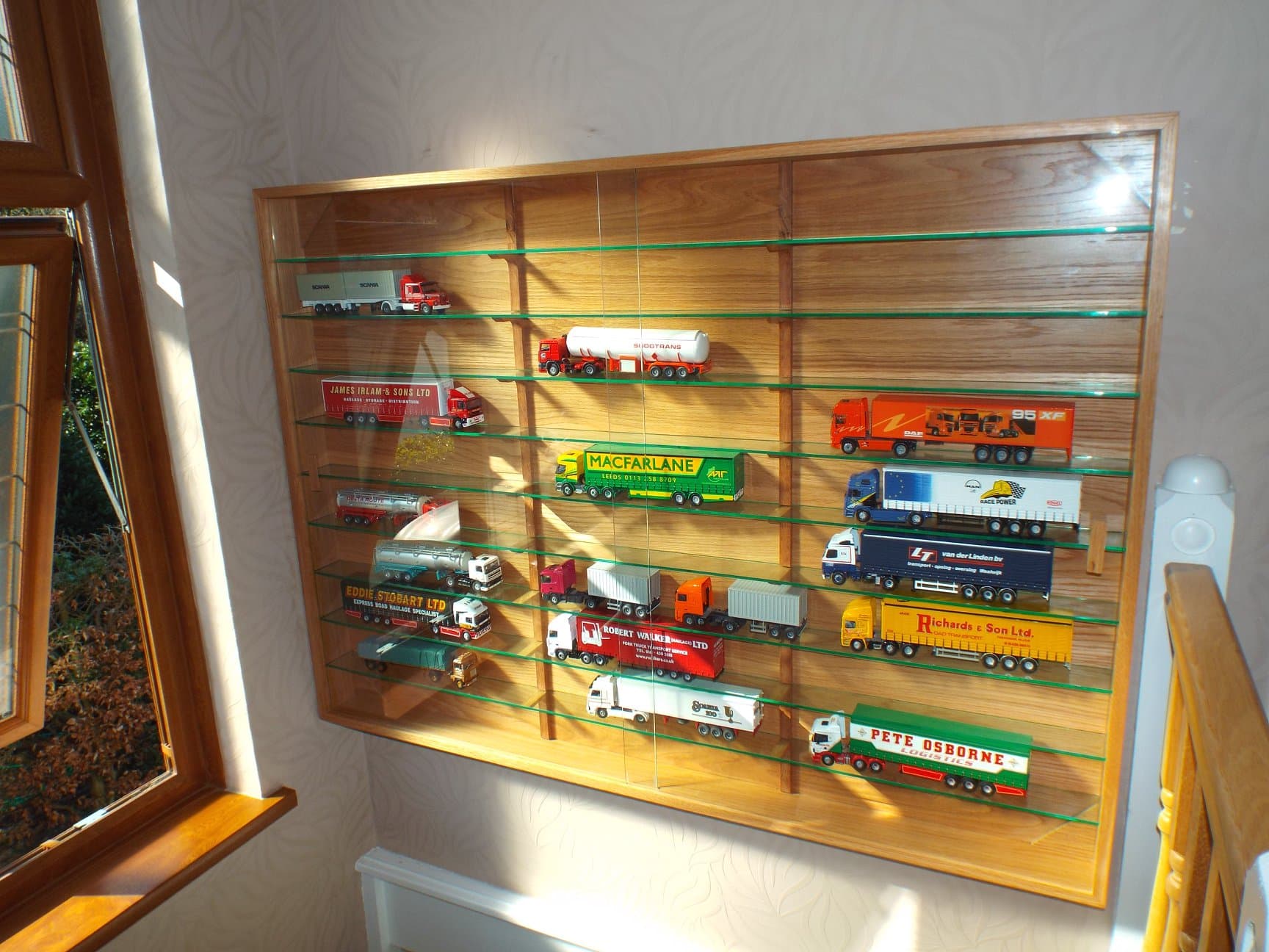 Close-up of oak display cabinet interior and glass doors