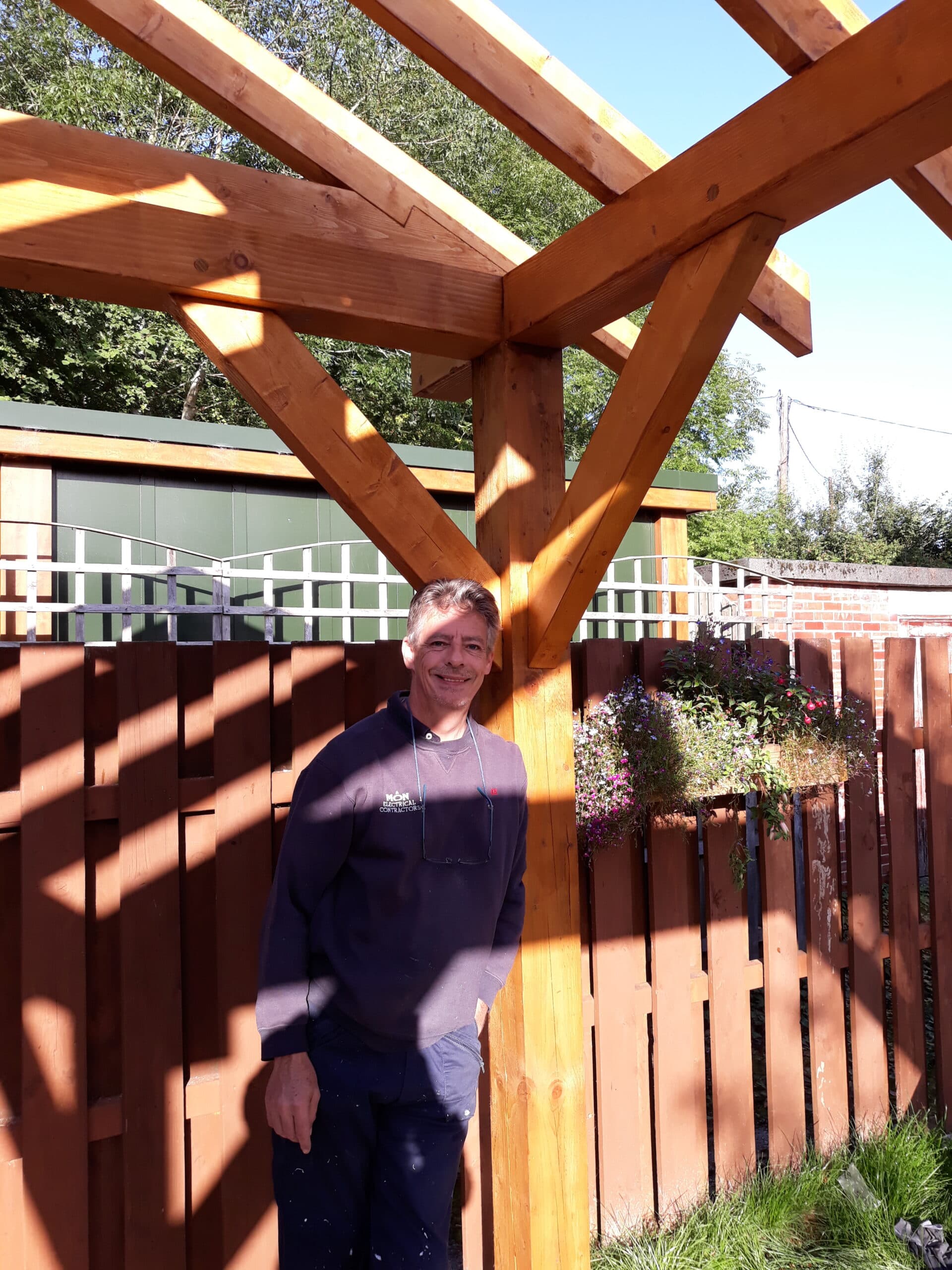 Timber garden pavilion under construction outdoors